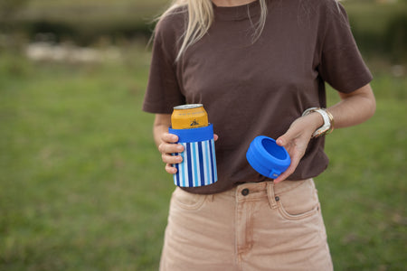 Ocean Breeze Cooler & Coffee Cup with a can inside and the lid in hand