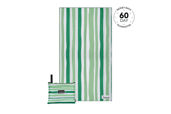 Green and white striped recycled beach towel with matching compact pouch, displayed flat with carrying strap visible