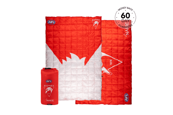 Red and white quilted puffy blanket featuring Sydney Swans AFL logo and swan design, shown unfolded