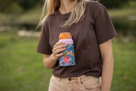 Kasey Rainbow Cooler & Coffee Cup holding a can