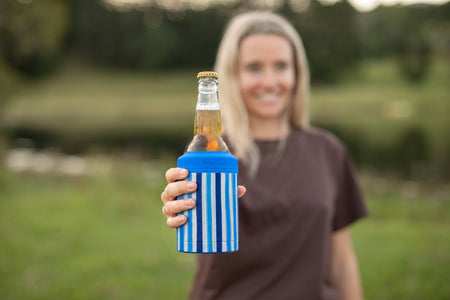 Ocean Breeze Cooler & Coffee Cup held out with a beer bottle inside