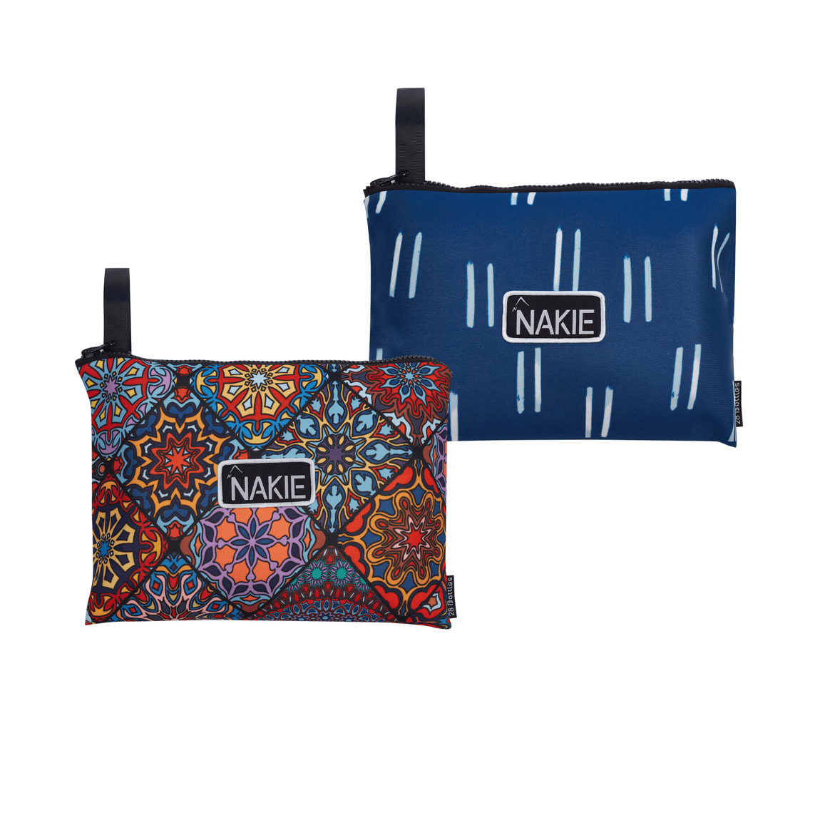 Studio shot of two unopened Nakie recycled sand-free beach towels inside their pouches, showcasing their compact and portable design for easy transportation.